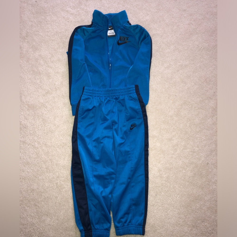 Nike 3T zip-up and joggers. Cyan blue with navy stripe.
